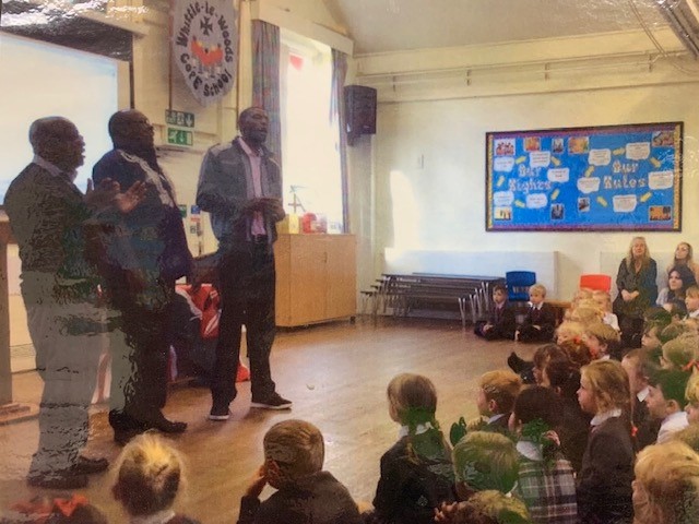 Image of clergy from Kenya in school worship